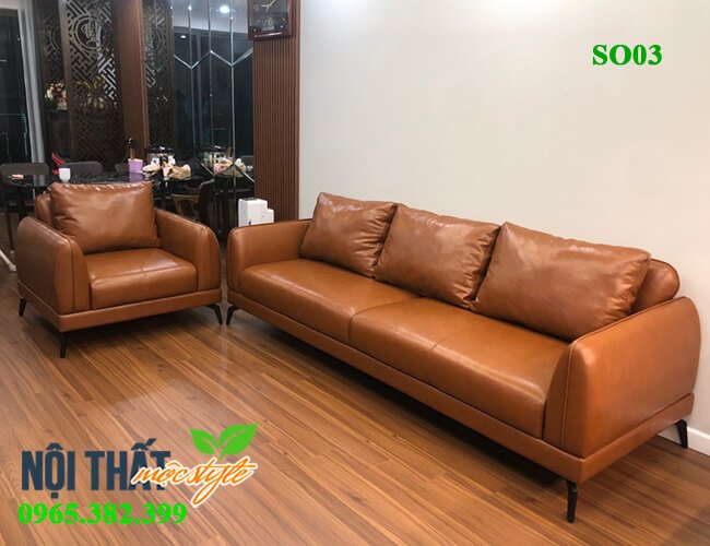 Trọn bộ sofa bọc da cực sang trọng và đồng bộ với tông màu của không gian phòng khách